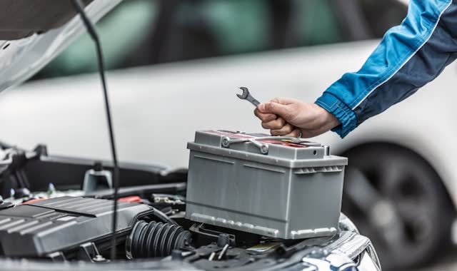 Car battery in engine bay